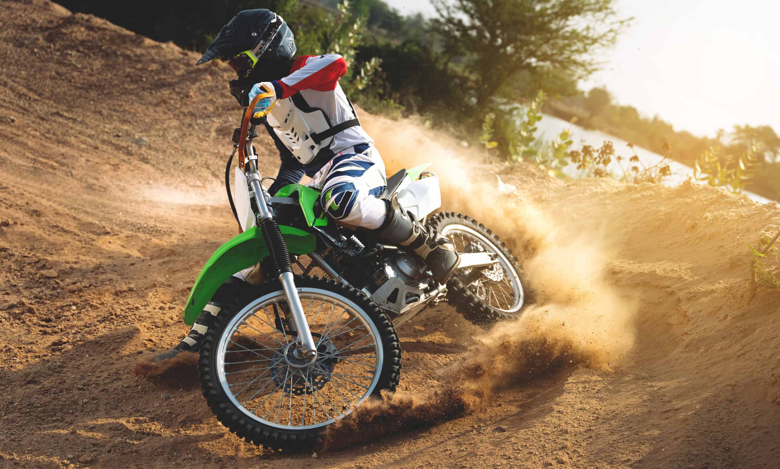 Young,Man,Practice,Riding,Dirt,Bike.splashing,Sand
